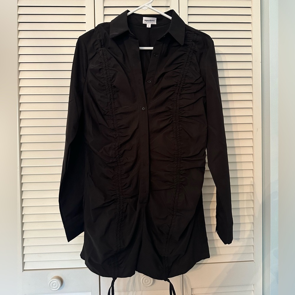 This is ‘Candice Ruched Romper in Black’